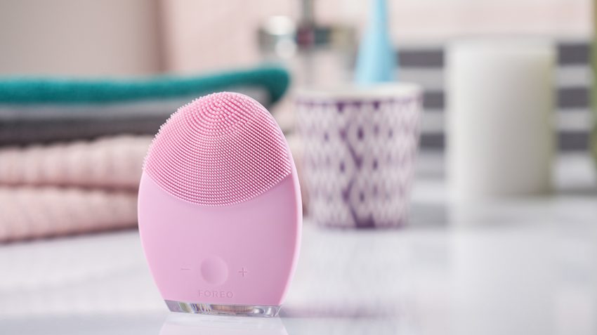 Pearl Pink FOREO LUNA 2 standing in bathroom