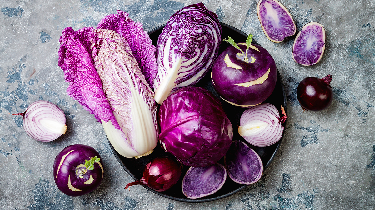 A bowl of purple vegetables on grey table