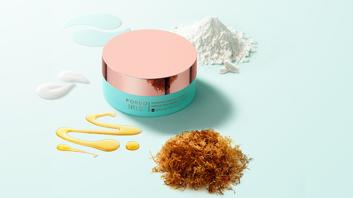 FOREO IRIS Hydrating Hydrogel Eye Mask on a flat surface with the ingredients and patches shown on the side