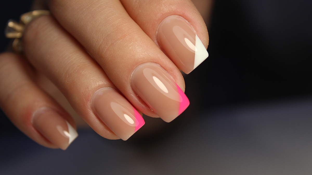 Manicured hand - transparent nails with pink and white details